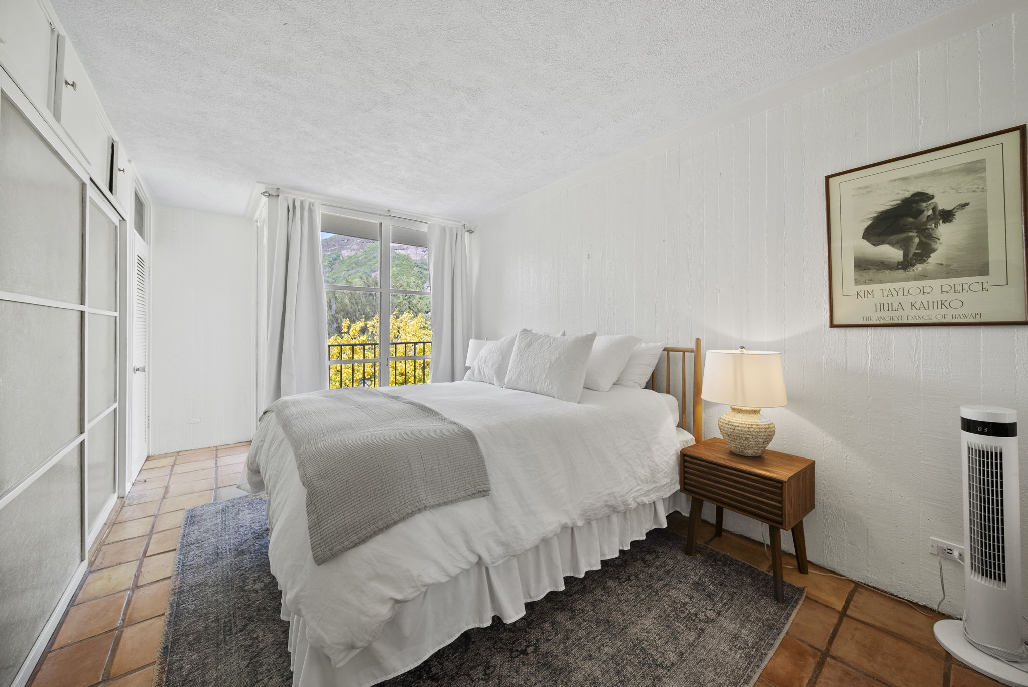 Bedroom with tropical greenery outside