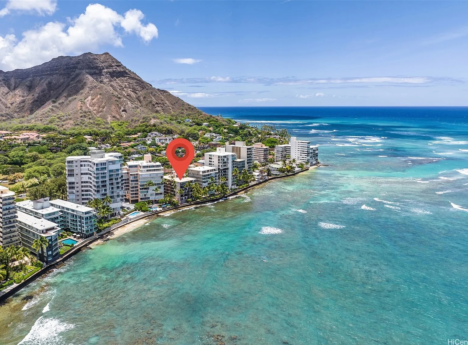 Aerial view of Waikīkī’s Gold Coast beneath Diamond Head, with the condo location marked